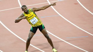 Usain Bolt of Jamaica celebrates after winning gold in the Men’s 100 metres final during day two of the 15th IAAF World Athletics Championships Beijing 2015 at Beijing National Stadium on August 23, 2015 in Beijing, China.