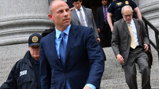 Michael Avenatti, attorney and founding partner of Eagan Avenatti LP, second left, exits from federal court in New York, U.S., on Tuesday, May 28, 2019.