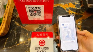A customer makes a payment using China’s digital currency, or e-CNY, at Wangfujing Department Store on February 11, 2021 in Beijing, China.