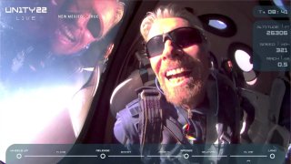 Billionaire Richard Branson reacts on board Virgin Galactic’s passenger rocket plane VSS Unity after reaching the edge of space above Spaceport America near Truth or Consequences, New Mexico, U.S. July 11, 2021 in a still image from video.