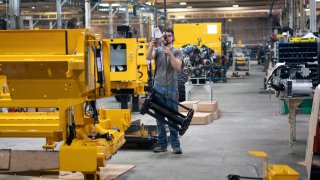 A worker hoists a flight chain at the Calder Brothers’ facility in Taylors, South Carolina, U.S., July 19, 2021.