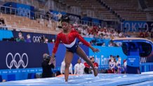 Simone Biles, of the United States, dismounts from the vault during the artistic gymnastics women's final at the 2020 Summer Olympics, Tuesday, July 27, 2021, in Tokyo.