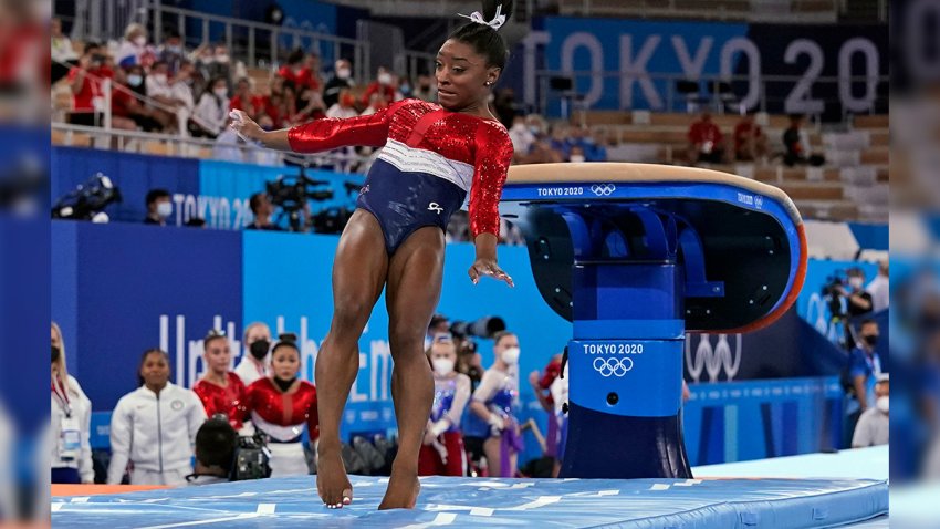 Simone Biles lands from the vault