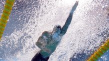 United States' Caeleb Dressel swims in a 100-meter freestyle heat at the 2020 Summer Olympics, Tuesday, July 27, 2021, in Tokyo.