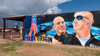 The side of a building in Van Horn, Texas, is adorned with a mural of Blue Origin founder Jeff Bezos on Saturday, July 17, 2021, just days before Bezos plans to launch into space from the Blue Origin spaceport about 25 miles outside of the West Texas town.