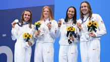 Silver medallists (from L) USA's Regan Smith, USA's Lydia Jacoby, USA's Torri Huske and USA's Abbey Weitzeil pose with their medals after the final of the women's 4x100m medley relay swimming event during the Tokyo 2020 Olympic Games at the Tokyo Aquatics Centre in Tokyo on August 1, 2021.