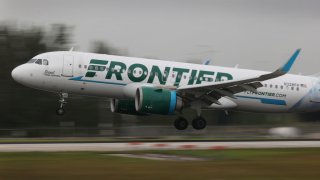 MIAMI, FLORIDA – JUNE 16: A Frontier airlines plane lands at the Miami International Airport on June 16, 2021 in Miami, Florida. Miami International Airport, founded in 1928, offers more flights to Latin America and the Caribbean than any other U.S. airport, is America’s third-busiest airport for international passengers, and is the top U.S. airport for international freight. (Photo by Joe Raedle/Getty Images)