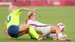 Lindsey Horan #9 of Team United States is challenged by Sofia Jakobsson #10 of Team Sweden during the Women's First Round Group G match between Sweden and United States during the Tokyo 2020 Olympic Games at Tokyo Stadium on July 21, 2021 in Chofu, Tokyo, Japan.