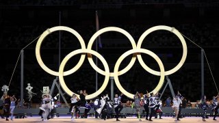 Performers dance as they assemble the Olympic Rings during the Opening Ceremony of the Tokyo 2020 Olympic Games at Olympic Stadium on July 23, 2021 in Tokyo, Japan.