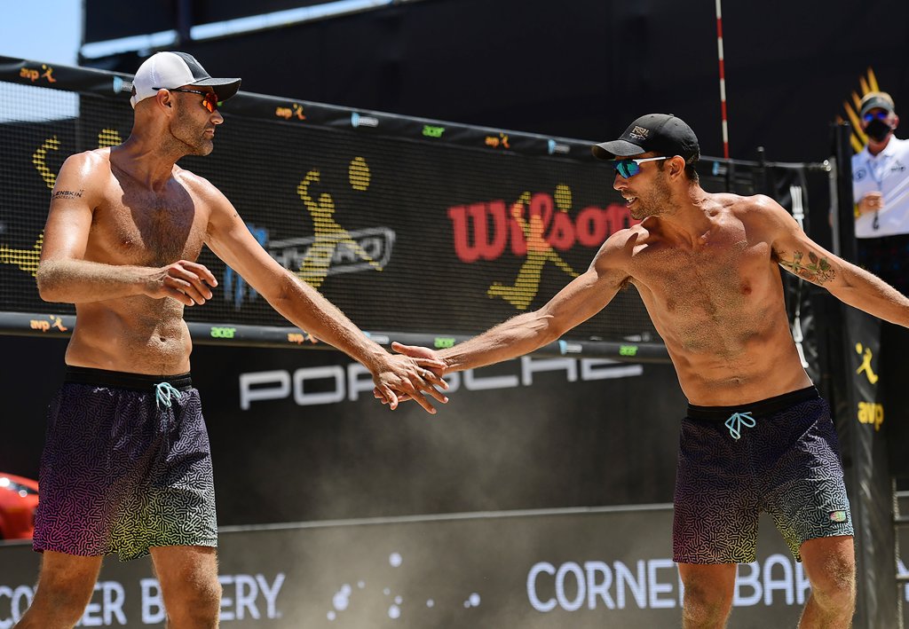 Phil Dalhausser and Nick Lucena celebrate in the finals against Trevor Crabb (not pictured) and Tri Bourne (not pictured) during the Porsche Cup on Aug. 2, 2020, in Long Beach, California.
