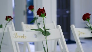 FILE - In this Nov. 12, 2017 file photo, a memorial for the victims of the shooting at Sutherland Springs Baptist Church includes 26 white chairs, each painted with a cross and and rose and placed in the sanctuary, in Sutherland Springs, Texas.