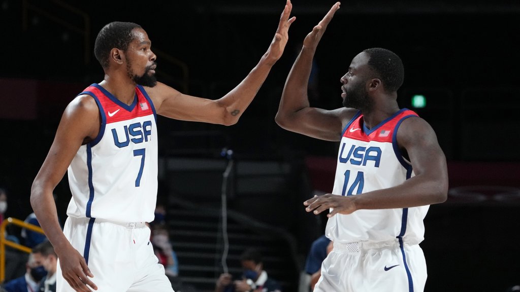 Jul 28, 2021; Saitama, Japan; USA player Kevin Durant (7) and USA player Draymond Green (14) high five as they play Iran during the Tokyo 2020 Olympic Summer Games at Saitama Super Arena.