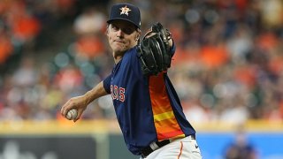 Zack Greinke #21 of the Houston Astros pitches in the first inning against the Texas Rangers at Minute Maid Park on July 25, 2021 in Houston, Texas.