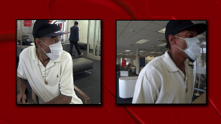 According to Arlington police, the man pictured above is wanted in connection with two bank robberies in Arlington Monday.