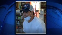 The male suspect threatened a Famous Footwear employee with a weapon and stole items before fleeing the scene, police said.