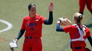 United States pitcher Cat Osterman celebrates with catcher Aubree Munro against Italy in an opening round softball game during the Tokyo Olympic Games at Fukushima Azuma Stadium. 