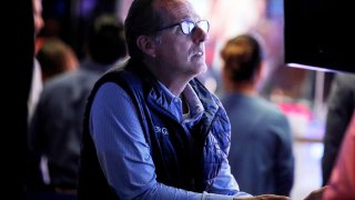 A specialist trader works inside his post on the floor of the New York Stock Exchange (NYSE).