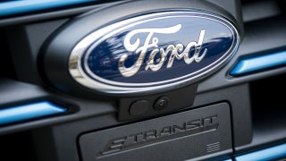 The badge of a Ford Motor Co. E-Transit electric vehicle during a presentation in Washington, D.C., U.S., on Wednesday, July 28, 2021.
