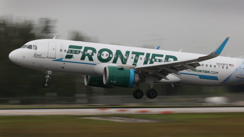 A Frontier airlines plane lands at the Miami International Airport on June 16, 2021 in Miami, Florida.