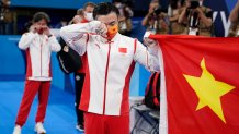 Liu Yang, of China, cries after winning gold
