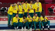 Australia poses for photos on the podium with their bronze medals after beating Slovenia during the Men's Basketball bronze medal game at the 2020 Olympics, Saturday, Aug. 7, 2021, in Tokyo, Japan.