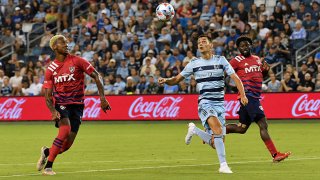 FILE: Daniel Salloi #20 of Sporting Kansas City tries to control the ball as Nkosi Tafari #14 and Emmanuel Twumasi #22 of FC Dallas track him during a game between FC Dallas and Sporting Kansas City at Children's Mercy Park on July 31, 2021 in Kansas City, Kansas.