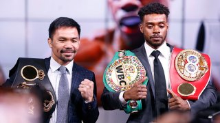 Manny Pacquiao and Errol Spence Jr pose for the media following their press conference at Fox Studios on July 11, 2021 in Los Angeles, California. Their fight is scheduled on Aug. 21, 2021 at T-Mobile Arena in Las Vegas, Nevada.