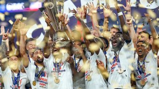 United States midfielder Kellyn Acosta (23) lifts the trophy to celebrate after winning the CONCACAF Gold Cup 2021 final match between Mexico and United States at Allegiant Stadium on August 1, 2021 in Las Vegas, NV.