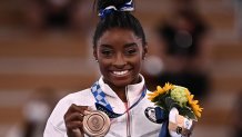 USA's Simone Biles poses with her bronze medal during the podium ceremony of the artistic gymnastics women's balance beam of the Tokyo 2020 Olympic Games at Ariake Gymnastics Centre in Tokyo on August 3, 2021.