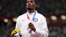 Silver medalist, Fred Kerley of Team USA, holds up his medal on the podium during the medal ceremony for the Men's 100-Meter on day 10 of the Tokyo 2020 Olympic Games at Olympic Stadium on Aug. 2, 2021, in Tokyo, Japan.