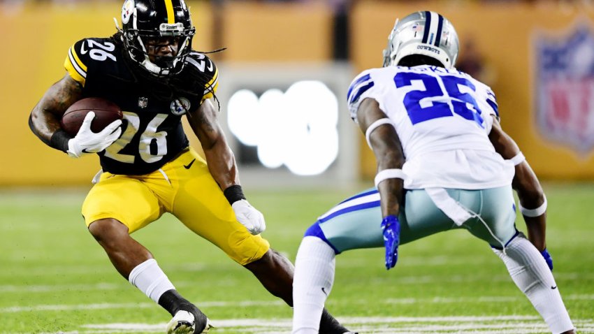 Anthony McFarland #26 of the Pittsburgh Steelers runs the ball past Steven Parker #25 of the Dallas Cowboys in the second half during the 2021 NFL preseason Hall of Fame Game at Tom Benson Hall Of Fame Stadium on August 5, 2021 in Canton, Ohio.