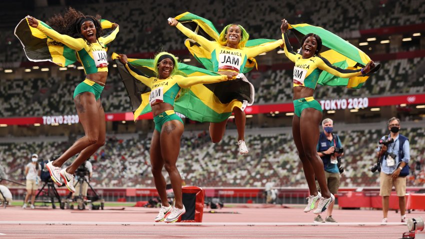 Briana Williams, Elaine Thompson-Herah, Shelly-Ann Fraser-Pryce and Shericka Jackson of Team Jamaica celebrate winning the gold medal in the Women's 4x100m relay on day fourteen of the Tokyo 2020 Olympic Games at Olympic Stadium on Aug. 6, 2021 in Tokyo, Japan.