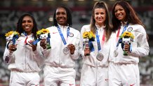 Silver medal winners Javianne Oliver, Teahna Daniels, Jenna Prandini and Gabrielle Thomas of Team United States stand on the podium during the medal ceremony for the Women’s 4x100-Meter Relay on day 15 of the Tokyo 2020 Olympic Games at Olympic Stadium on Aug. 7, 2021, in Tokyo, Japan.