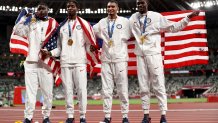 Gold medal winners Bryce Deadmon, Michael Cherry, Michael Norman and Rai Benjamin of Team United States celebrate with their medals after the Men's 4 x 400m Relay on day fifteen of the Tokyo 2020 Olympic Games at Olympic Stadium on Aug. 7, 2021 in Tokyo, Japan.
