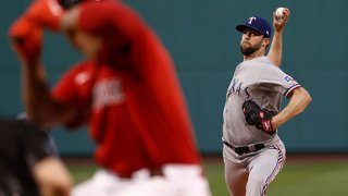 Jordan Lyles #24 of the Texas Rangers pitches against the Boston Red Sox during the first inning at Fenway Park on Aug. 21, 2021 in Boston, Massachusetts.