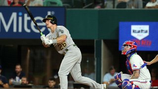 Matt Chapman #26 of the Oakland Athletics hits a home run in the seventh inning against the Texas Rangers at Globe Life Field on Aug. 14, 2021 in Arlington, Texas.
