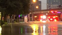 Ross Avenue near US Highway 75 in Dallas looks more like a river Wednesday night as thousands of gallons of water filled the street.