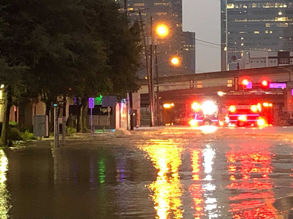 Ross Avenue near US Highway 75 in Dallas looks more like a river Wednesday night as thousands of gallons of water filled the street.