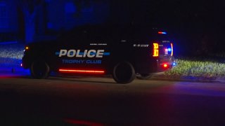 A man was taken into custody late Wednesday in connection with a reported kidnapping after a standoff in a Trophy Club neighborhood.