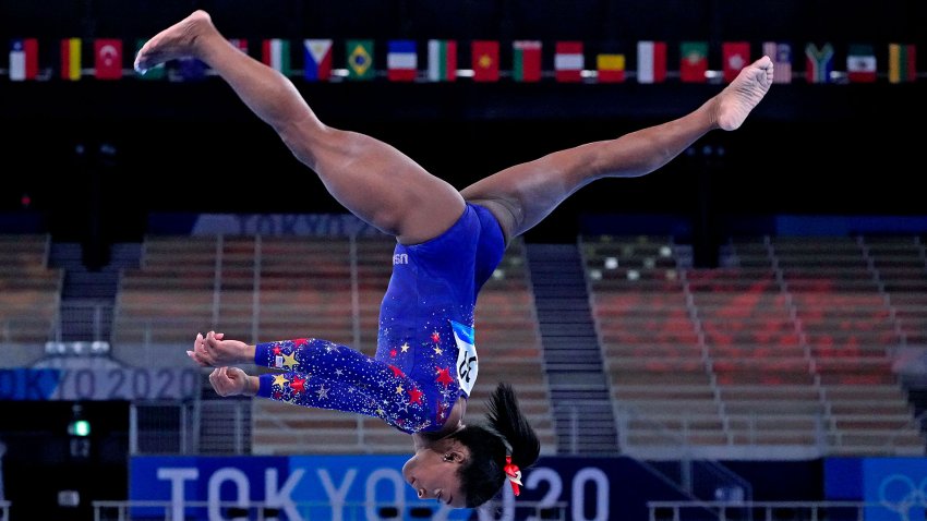 Simone Biles competes on beam