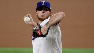 A.J. Alexy of the Texas Rangers makes his Major League debut pitching against the Colorado Rockies in the top of the first inning at Globe Life Field on Aug. 30, 2021 in Arlington, Texas.