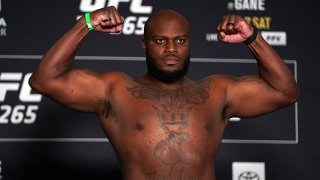 Derrick Lewis poses on the scale during the UFC 265 official weigh-in at Hyatt Regency Houston on Aug. 6, 2021 in Houston, Texas.