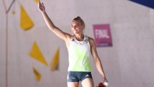 Janja Garnbret of Slovenia celebrates after getting a top during the sport climbing women's combined final on Day 14 of the Tokyo 2020 Olympic Games at Aomi Urban Sports Park