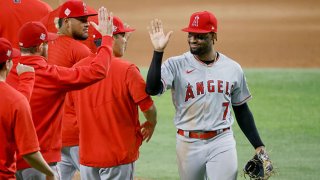 Jo Adell #7 of the Los Angeles Angels celebrates their 11-3 win over the Texas Rangers at Globe Life Field on Aug. 3, 2021 in Arlington, Texas.