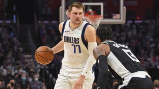 Luka Doncic #77 of the Dallas Mavericks handles the ball against Paul George #13 of the LA Clippers during Round 1, Game 7 of the 2021 NBA Playoffs on June 6, 2021 at STAPLES Center in Los Angeles, California.