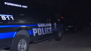 A man accused of murder was arrested after a hours-long standoff with Garland officers, police said.