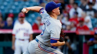 Texas Rangers starting pitcher Kolby Allard throws to a Los Angeles Angels batter during the first inning of a baseball game in Anaheim, Calif., Saturday, Sept. 4, 2021.