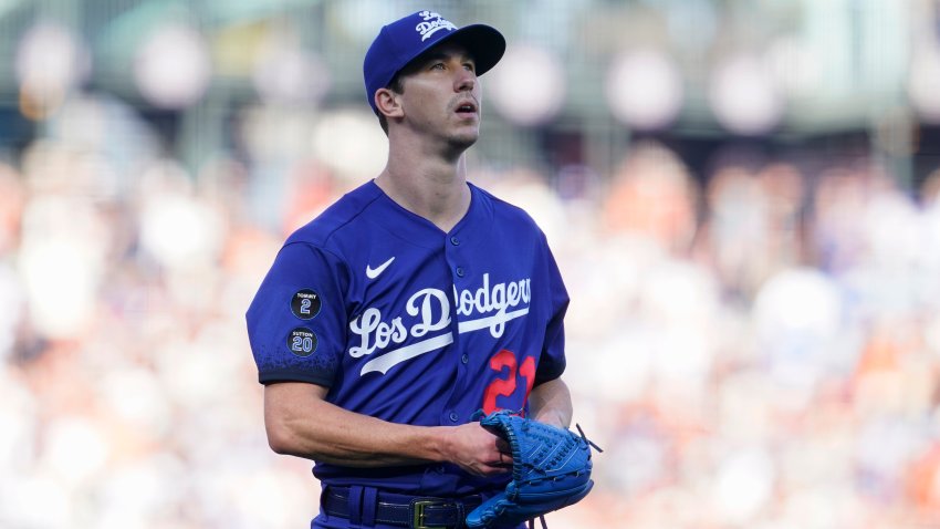 Los Angeles Dodgers pitcher Walker Buehler walks to the dugout after the third inning of a baseball game against the San Francisco Giants in San Francisco, Sunday, Sept. 5, 2021. (AP Photo/Jeff Chiu)