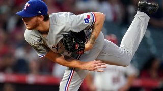 Texas Rangers starting pitcher A.J. Alexy throws to the Los Angeles Angels