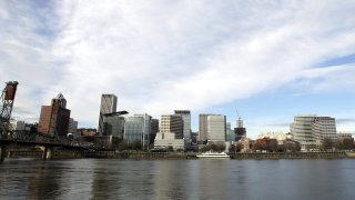In this Dec. 13, 2014 file photo the Portland skyline is visible on the west bank of the Willamette River in Portland, Ore.